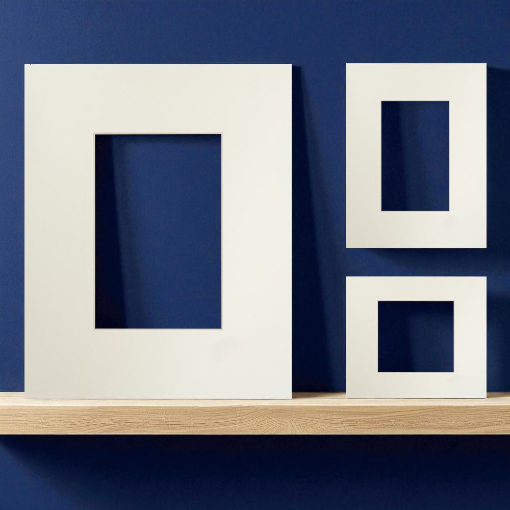 A set of clean, off-white picture mounts